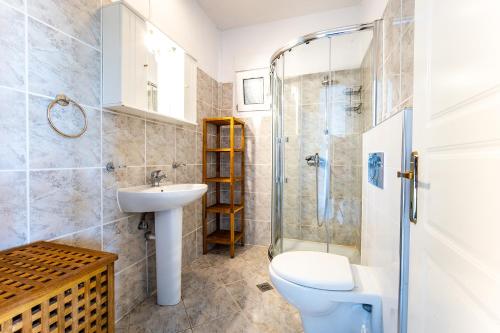 a bathroom with a toilet sink and a shower at Dimitra Beach Apartments - Thassos Skala Potamias in Skala Potamias