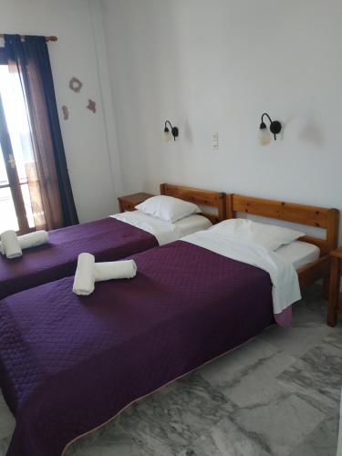 A bed or beds in a room at Παραθαλασσια στουντιο Μιχαλιας Sea view studio Michalias
