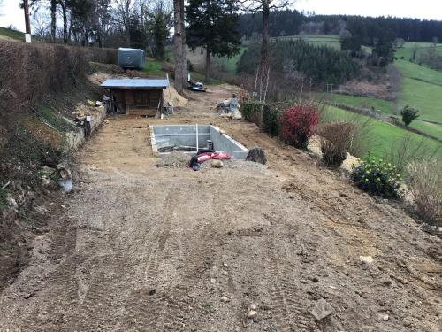 an unfinished garden with a pool in the dirt at La Mazille , cossy vakantiestudio met zwembad in zuid-Bourgogne in Anglure-sous-Dun