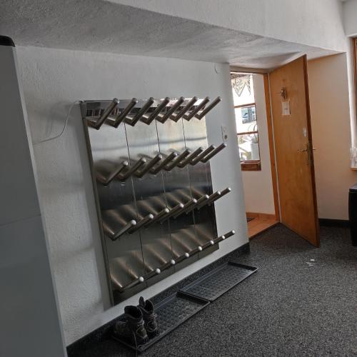 a row of wine racks in an oven at Hotel Post - Garni in Bichlbach