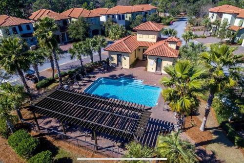 an aerial view of a resort with a swimming pool at 4 Bedroom house on the golf course with 2 golf carts! in Destin