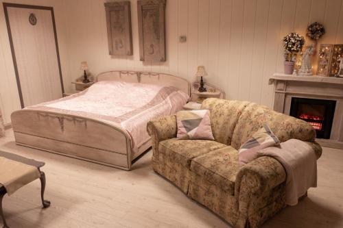 מיטה או מיטות בחדר ב-Agroturystyka Ranczo
