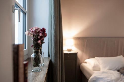 Un ou plusieurs lits dans un hébergement de l'établissement Bogen bistro & apartments