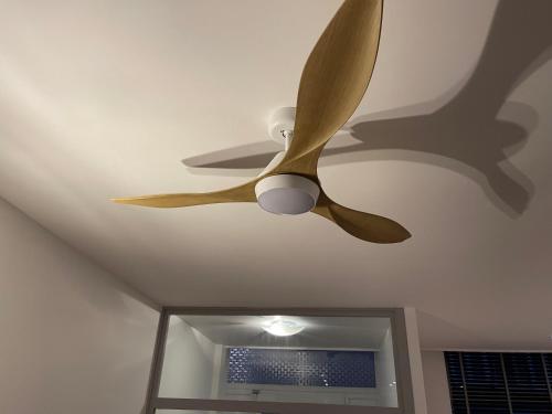 a ceiling fan on the ceiling of a room at Le VILLAGE d'EZRA in Brussels