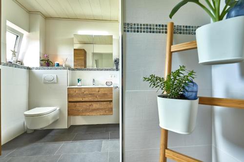a bathroom with a toilet and a sink at The Old Farmhouse in Edling
