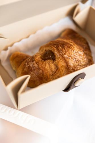 a loaf of bread sitting in a box at Hotel Suite Inn in Udine