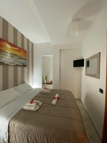 a bedroom with a large bed in a room at Casa Domy in Cinisi