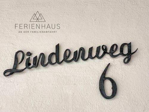 a sign that reads dunelinated on a wall at Gartenwohnung an der Familienabfahrt in Brixen im Thale