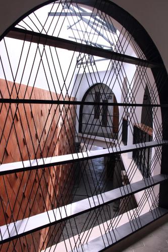 a glass window in a room with a view at HOTEL CHURUMUCO in San José Iturbide