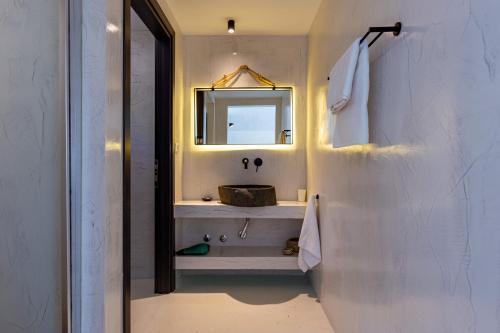 a bathroom with a sink and a mirror at Casa Bloo Adults Only in Elia