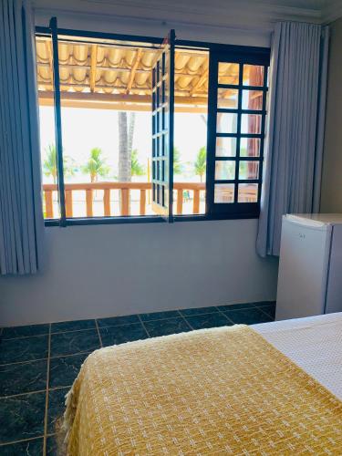 Postel nebo postele na pokoji v ubytování Suíte frente mar e pés na areia