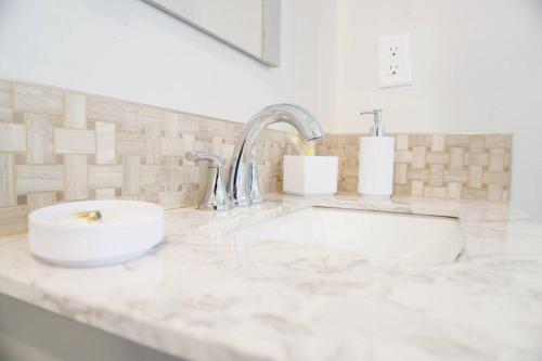 a white counter top with a sink in a bathroom at Spacious Guest Suite Amazing Location in San Diego