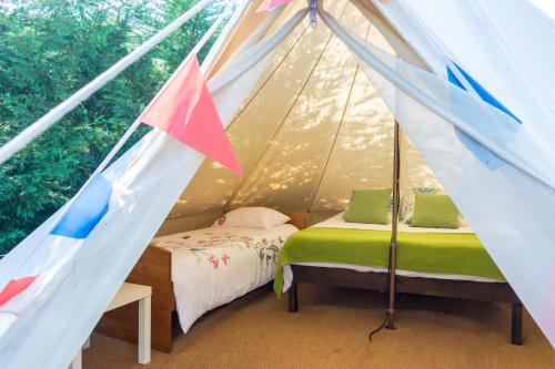 A bed or beds in a room at Arrabia Glamping Bell Tents