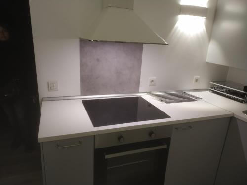 a kitchen with a sink and a counter top at Duplex Viennois in Vienne