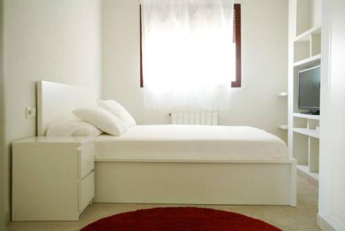 Posteľ alebo postele v izbe v ubytovaní Apartamento de capricho 1ª línea de playa