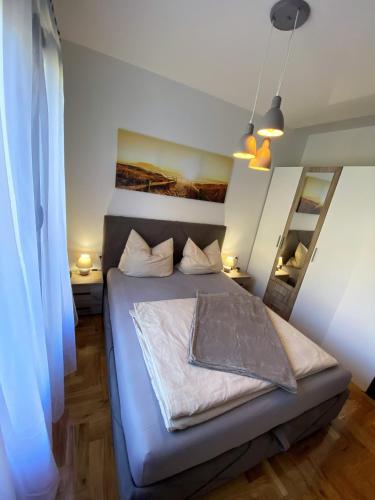 a bedroom with a bed in a room at MonteRelax Apartments Becici in Rafailovici