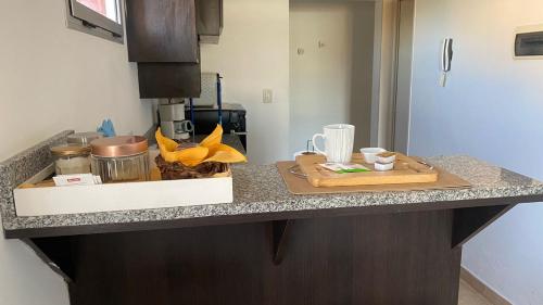 a kitchen counter with two cutting boards on it at Punto Maschwitz Alquileres - Monoambiente in Ingeniero Maschwitz