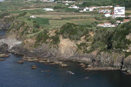 an aerial view of a rocky island in the water at Quinta Rico - House II in Praia da Vitória