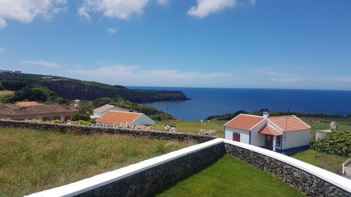 a view of the ocean from the balcony of a house at Quinta Rico - House II in Praia da Vitória