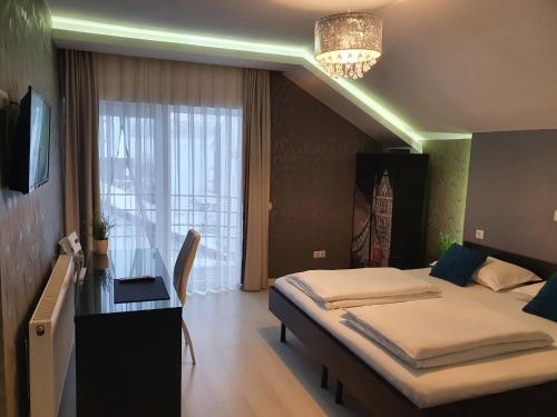 Una cama o camas en una habitación de Vila Privilege Felix