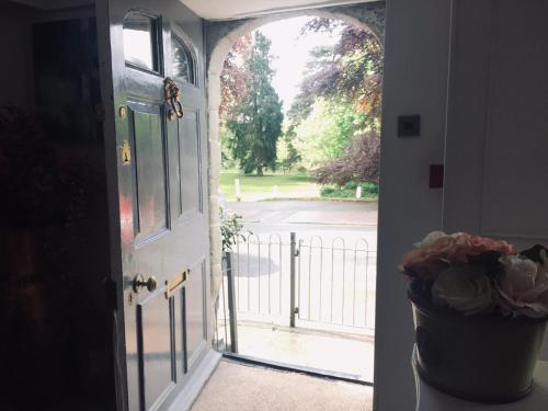 an open door with a view of a yard at The Whitehouse Ross-On-Wye in Ross on Wye