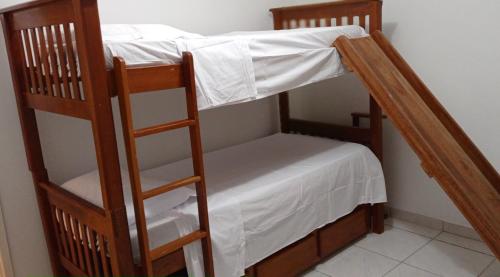 a couple of bunk beds in a room at Apto Olinda Casa Caiada ao lado do Shopping in Olinda