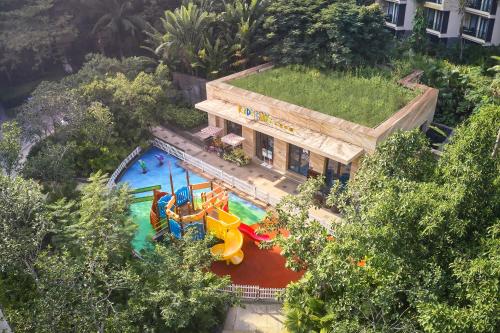 an overhead view of a pool with a water park at Wanda Realm Resort Sanya Haitang Bay in Sanya