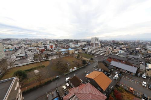 an aerial view of a city with buildings at Smile Hotel Takaoka Ekimae in Takaoka