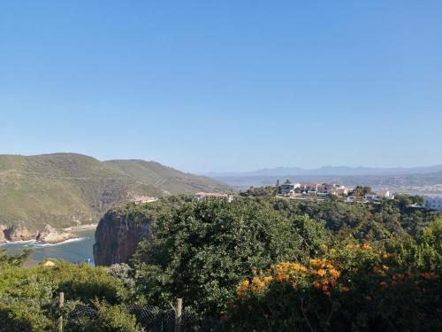 a view of the ocean from a hill at Castle On The Heads in Knysna