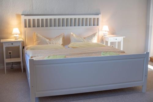 En eller flere senge i et værelse på Ferienhaus Brockenblick