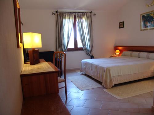En eller flere senger på et rom på Il Gabbiano