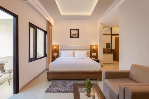 Postel nebo postele na pokoji v ubytování Pride Ashiyana Resort Mussoorie