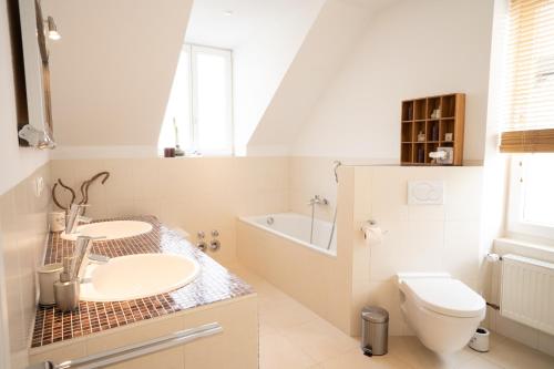 a bathroom with a sink and a toilet at Ferienwohnung Leonie nahe Detmold Zentrum in Detmold