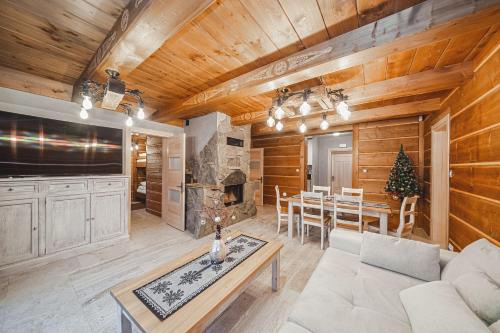 a living room with a couch and a table at TatrApart in Zakopane