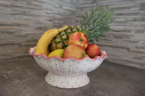 a bowl of fruit with apples bananas and pears at Familien & Wander-Pension Purkhardt in Donnersbachwald