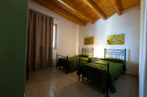 เตียงในห้องที่ Residenza la Payara