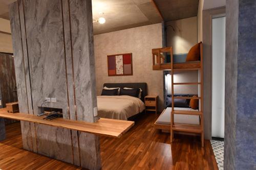 a bedroom with a bunk bed and a bedroom with a bunk bed gmaxwell gmaxwell gmaxwell at Fu's house 52 in Tainan