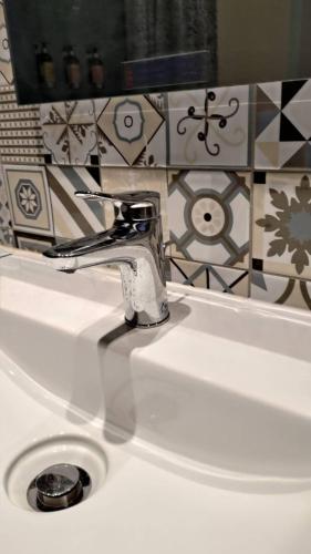a bathroom sink with a faucet on top of it at Fu's house 52 in Tainan