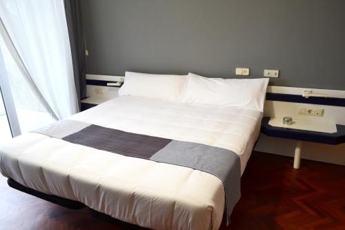 Postel nebo postele na pokoji v ubytování Hotel Alda Sada Marina