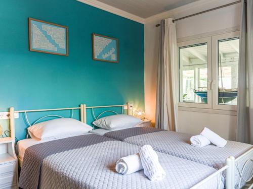 A bed or beds in a room at Casa Markapela