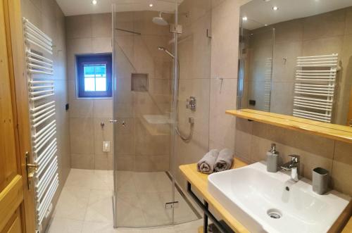 a bathroom with a shower and a sink and a shower at KOASALIFE in Going
