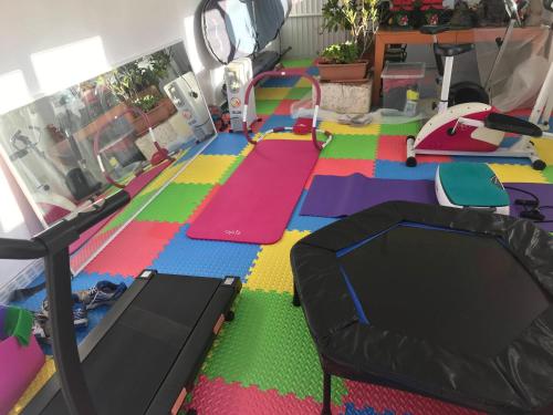 a room with colorful mats on the floor at Bob's House quiet retreat with large shared garden in Loughborough