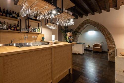 a kitchen with a counter with a sink and an archway at Gratteri Resort in Gratteri