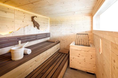 a wooden sauna with a duck on the wall at Leamwirt in Hopfgarten im Brixental