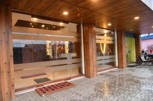 a glass wall with a game of chess on the floor at Hotel Lake View in Port Blair
