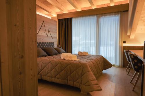 Postel nebo postele na pokoji v ubytování Hotel La Perla