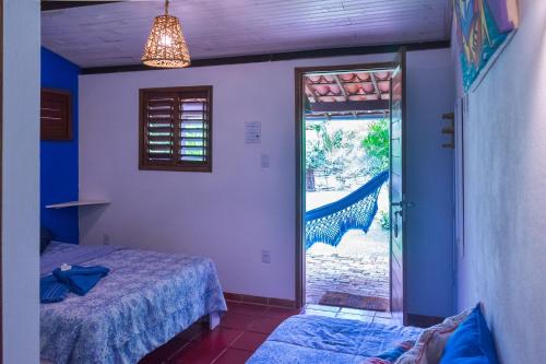 Katil atau katil-katil dalam bilik di Pousada Casa Do Cocotier