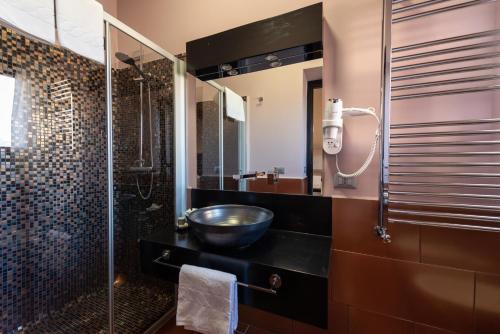 a bathroom with a sink and a shower at Gratteri Resort in Gratteri