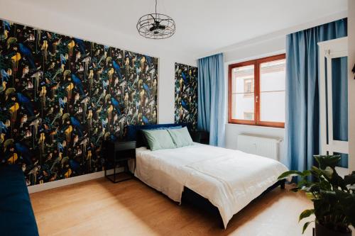 Кровать или кровати в номере Apartament Rynek Więzienna