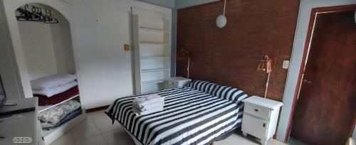 Una cama o camas en una habitación de Merlo 1